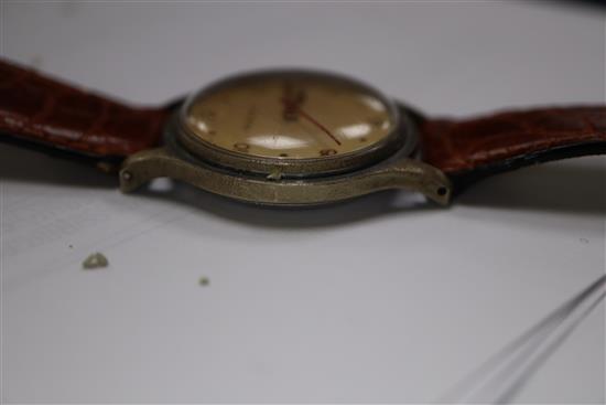 A gentlemans Jaeger Le Coultre wristwatch with red seconds hand, dated 1950 and a Bucherer gold plated